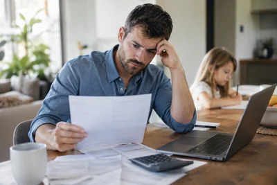 An Oregon parent reviews child support documents after a change in employment income.